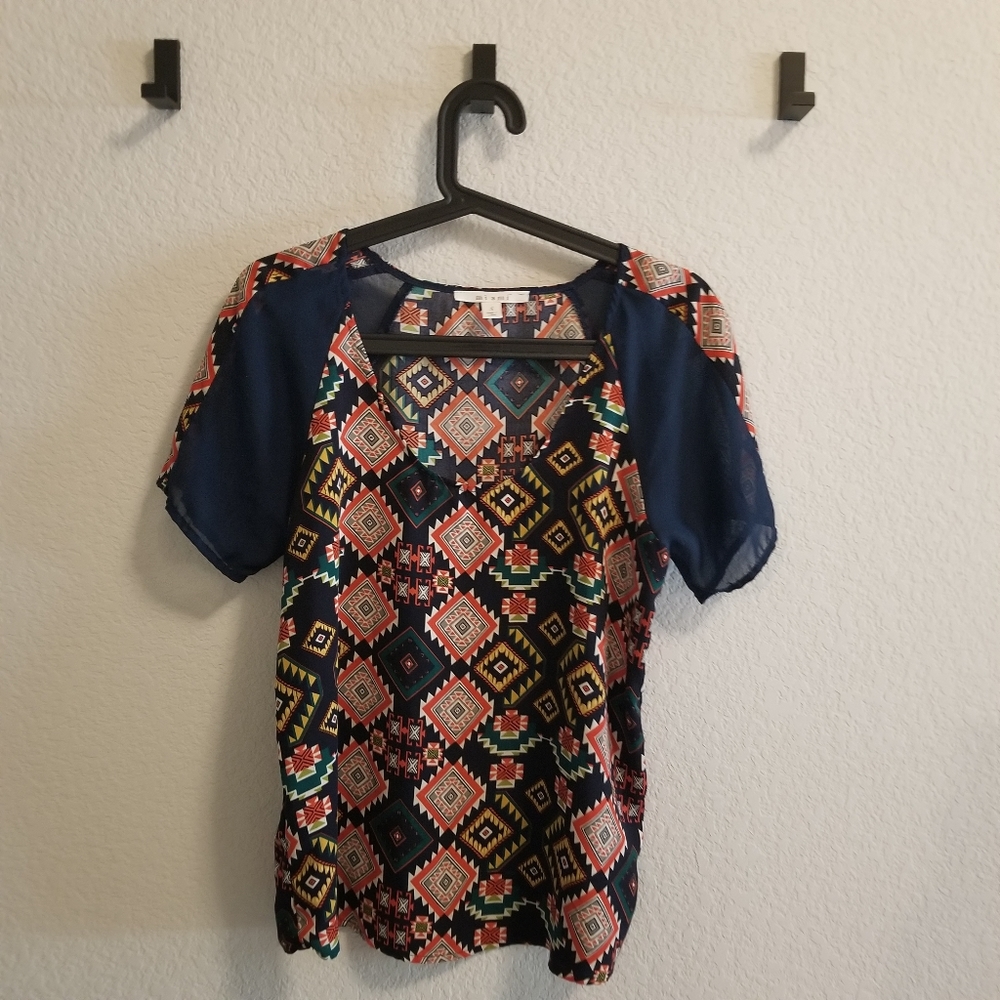 Patterned top with sheer sleeve